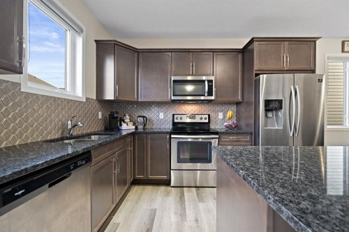 418 Windrow Common Sw, Airdrie, AB - Indoor Photo Showing Kitchen With Stainless Steel Kitchen With Upgraded Kitchen
