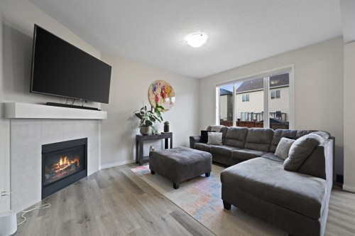 418 Windrow Common Sw, Airdrie, AB - Indoor Photo Showing Living Room With Fireplace