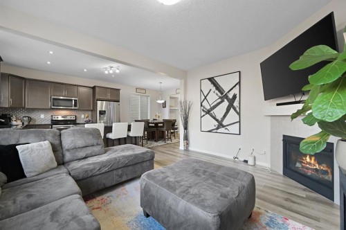 418 Windrow Common Sw, Airdrie, AB - Indoor Photo Showing Living Room With Fireplace