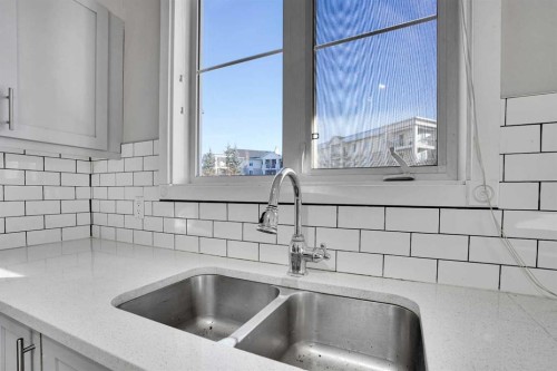 1119-333 Taravista Drive Ne, Calgary, AB - Indoor Photo Showing Kitchen With Double Sink