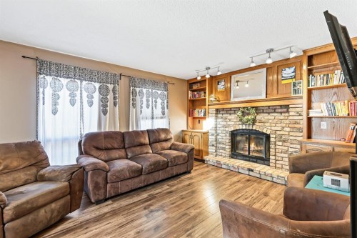 123 Mckerrell Crescent Se, Calgary, AB - Indoor Photo Showing Living Room With Fireplace