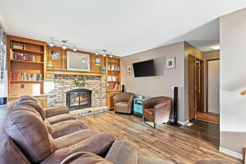 123 Mckerrell Crescent Se, Calgary, AB - Indoor Photo Showing Living Room With Fireplace