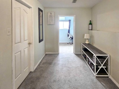 94 Hidden Spring Green Nw, Calgary, AB - Indoor Photo Showing Other Room