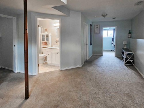 94 Hidden Spring Green Nw, Calgary, AB - Indoor Photo Showing Other Room