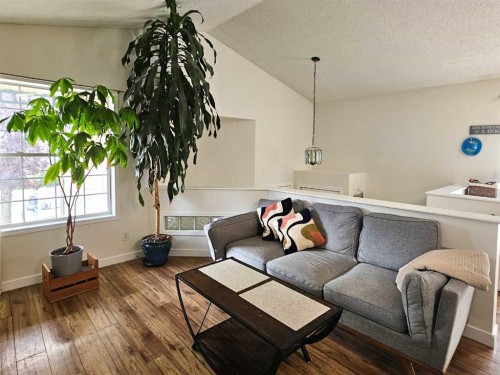94 Hidden Spring Green Nw, Calgary, AB - Indoor Photo Showing Living Room