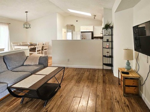 94 Hidden Spring Green Nw, Calgary, AB - Indoor Photo Showing Living Room