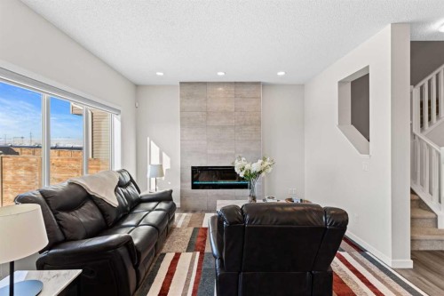 492 Chinook Gate Square Sw, Airdrie, AB - Indoor Photo Showing Living Room With Fireplace