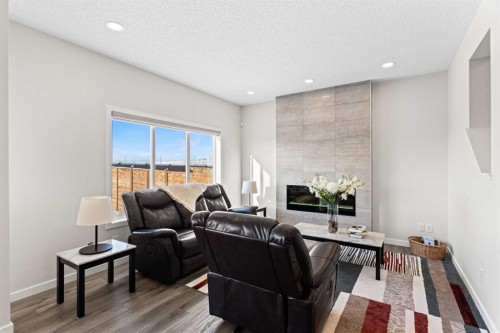 492 Chinook Gate Square Sw, Airdrie, AB - Indoor Photo Showing Living Room With Fireplace