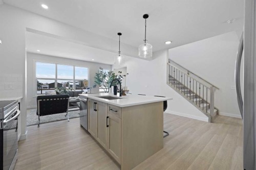 111 Fireside Street, Cochrane, AB - Indoor Photo Showing Kitchen With Upgraded Kitchen