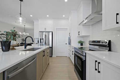 111 Fireside Street, Cochrane, AB - Indoor Photo Showing Kitchen With Upgraded Kitchen