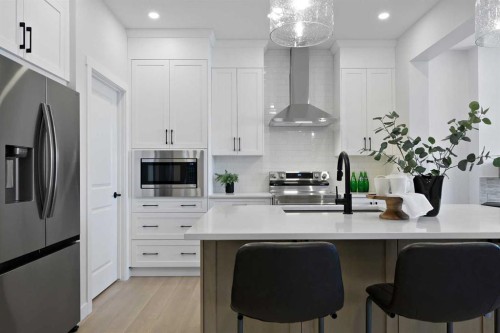 111 Fireside Street, Cochrane, AB - Indoor Photo Showing Kitchen With Upgraded Kitchen