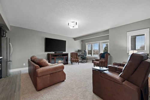 76 Legacy Circle Se, Calgary, AB - Indoor Photo Showing Living Room With Fireplace