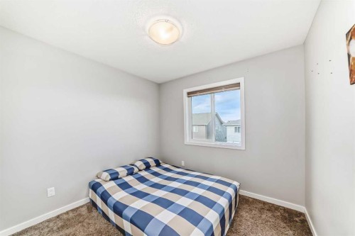 1810 Baywater Drive Sw, Airdrie, AB - Indoor Photo Showing Bedroom