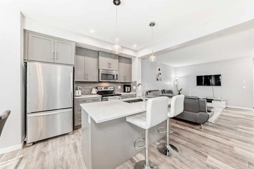1810 Baywater Drive Sw, Airdrie, AB - Indoor Photo Showing Kitchen With Stainless Steel Kitchen With Upgraded Kitchen