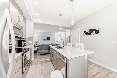 1810 Baywater Drive Sw, Airdrie, AB - Indoor Photo Showing Kitchen With Upgraded Kitchen