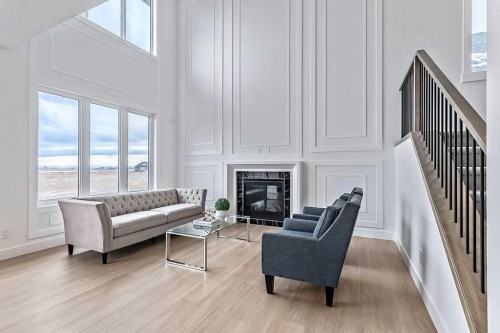 29 North Bridges Landing, Langdon, AB - Indoor Photo Showing Living Room With Fireplace
