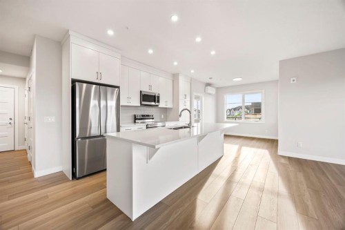 2202-2117 81 Street Sw, Calgary, AB - Indoor Photo Showing Kitchen With Stainless Steel Kitchen With Upgraded Kitchen