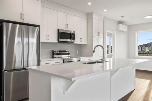 2202-2117 81 Street Sw, Calgary, AB - Indoor Photo Showing Kitchen With Stainless Steel Kitchen With Double Sink With Upgraded Kitchen