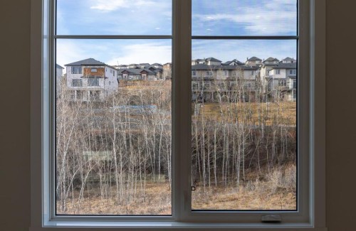 2202-2117 81 Street Sw, Calgary, AB - Indoor Photo Showing Other Room With Body Of Water