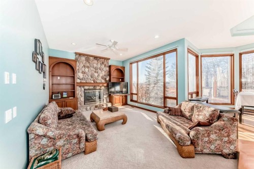 67 Evergreen Rise Sw, Calgary, AB - Indoor Photo Showing Living Room With Fireplace