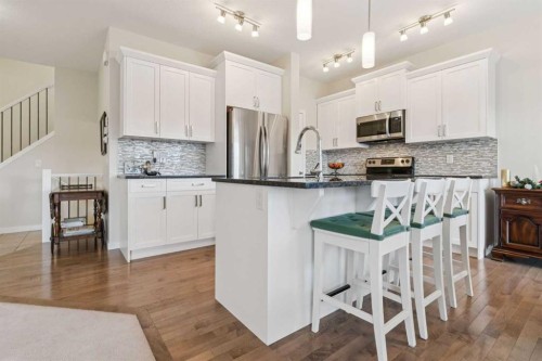 71 Mount Rae Heights, Okotoks, AB - Indoor Photo Showing Kitchen With Upgraded Kitchen