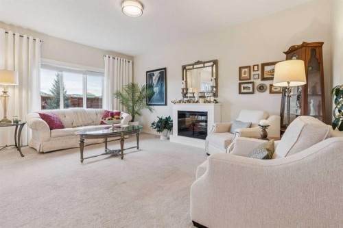 71 Mount Rae Heights, Okotoks, AB - Indoor Photo Showing Living Room With Fireplace