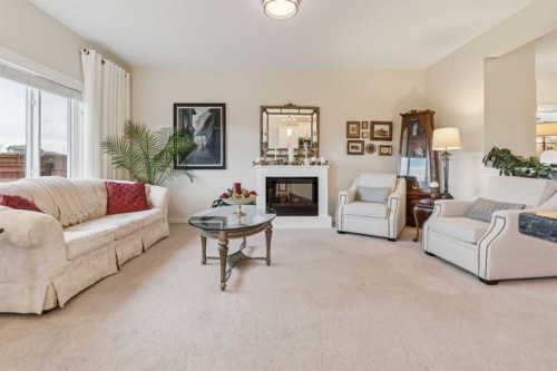 71 Mount Rae Heights, Okotoks, AB - Indoor Photo Showing Living Room With Fireplace