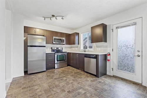 148 Copperpond Boulevard Se, Calgary, AB - Indoor Photo Showing Kitchen With Stainless Steel Kitchen