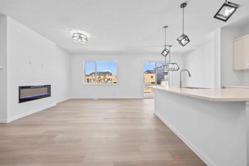 2321 Lancaster Heights Se, Airdrie, AB - Indoor With Fireplace