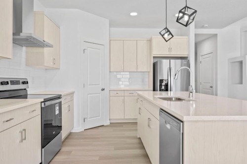 2321 Lancaster Heights Se, Airdrie, AB - Indoor Photo Showing Kitchen With Upgraded Kitchen