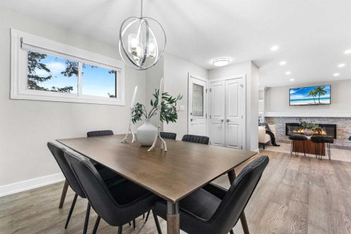 860 Archwood Road Se, Calgary, AB - Indoor Photo Showing Dining Room With Fireplace