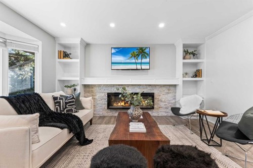 860 Archwood Road Se, Calgary, AB - Indoor Photo Showing Living Room With Fireplace