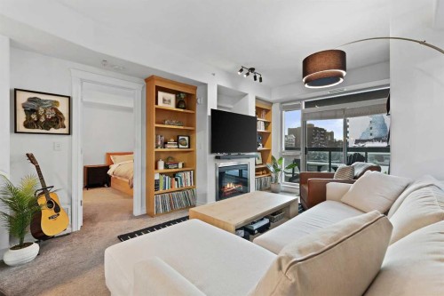 305-836 15 Avenue Sw, Calgary, AB - Indoor Photo Showing Living Room With Fireplace
