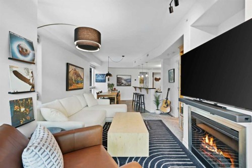 305-836 15 Avenue Sw, Calgary, AB - Indoor Photo Showing Living Room With Fireplace