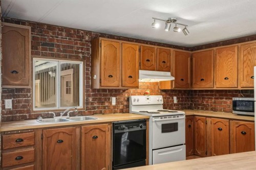 8 29415 Range Rd 52,, Rural Mountain View County, AB - Indoor Photo Showing Kitchen With Double Sink