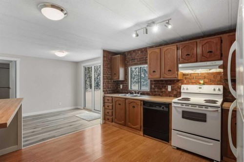 8 29415 Range Rd 52,, Rural Mountain View County, AB - Indoor Photo Showing Kitchen With Double Sink
