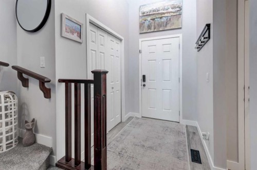 44 New Brighton Landing Se, Calgary, AB - Indoor Photo Showing Living Room With Fireplace