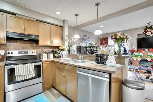 56 Country Village Manor Ne, Calgary, AB - Indoor Photo Showing Kitchen With Stainless Steel Kitchen With Double Sink