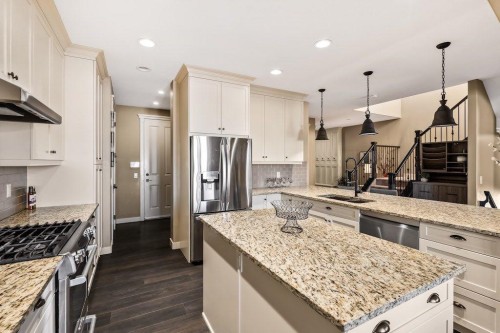 111 Marquis Cove Se, Calgary, AB - Indoor Photo Showing Kitchen With Stainless Steel Kitchen With Double Sink With Upgraded Kitchen