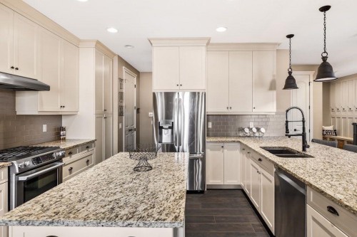 111 Marquis Cove Se, Calgary, AB - Indoor Photo Showing Kitchen With Stainless Steel Kitchen With Double Sink With Upgraded Kitchen