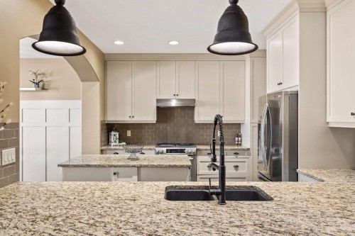 111 Marquis Cove Se, Calgary, AB - Indoor Photo Showing Kitchen With Stainless Steel Kitchen With Double Sink With Upgraded Kitchen