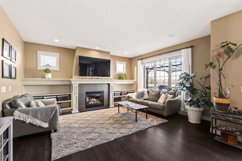 111 Marquis Cove Se, Calgary, AB - Indoor Photo Showing Living Room With Fireplace