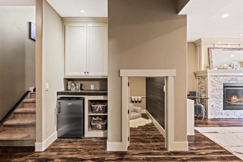 111 Marquis Cove Se, Calgary, AB - Indoor Photo Showing Other Room With Fireplace