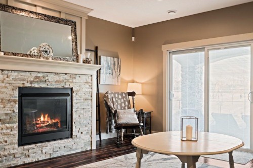 111 Marquis Cove Se, Calgary, AB - Indoor Photo Showing Living Room With Fireplace