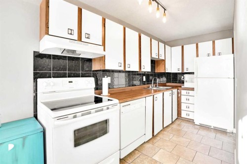 202-1529 26 Avenue Sw, Calgary, AB - Indoor Photo Showing Kitchen