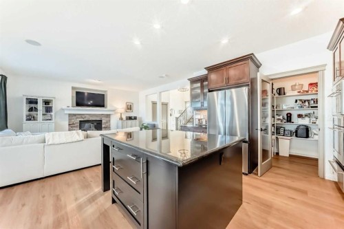 135 Autumn Close Se, Calgary, AB - Indoor Photo Showing Kitchen With Fireplace With Upgraded Kitchen