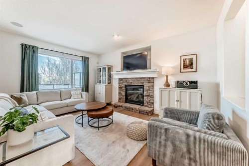 135 Autumn Close Se, Calgary, AB - Indoor Photo Showing Living Room With Fireplace