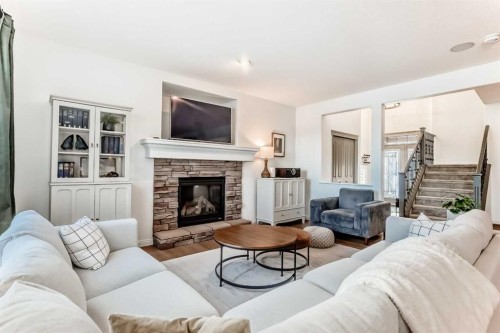 135 Autumn Close Se, Calgary, AB - Indoor Photo Showing Living Room With Fireplace