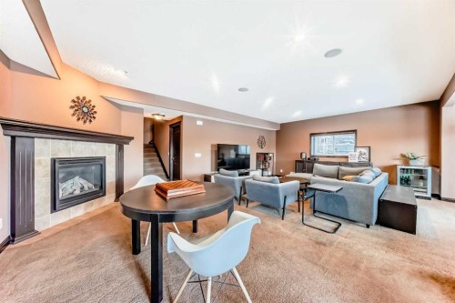135 Autumn Close Se, Calgary, AB - Indoor Photo Showing Living Room With Fireplace
