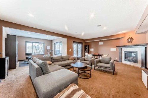 135 Autumn Close Se, Calgary, AB - Indoor Photo Showing Living Room With Fireplace